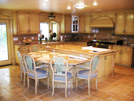 A typical Kitchen with dining table set. It also links to a page which displays the same image but larger size.
